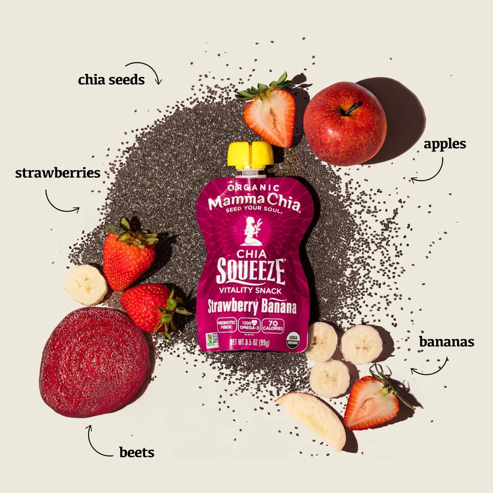 Pink chia squeeze pouch surrounded by chia seeds, strawberries, bananas, an apple, and a beet slice on a light background. Organic and fresh.